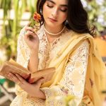 The Elaf-Roshne Luxury Lawn 3pc features embroidered lawn, an embroidered organza neckline, a dyed cambric trouser, and an embroidered cotton net dupatta.